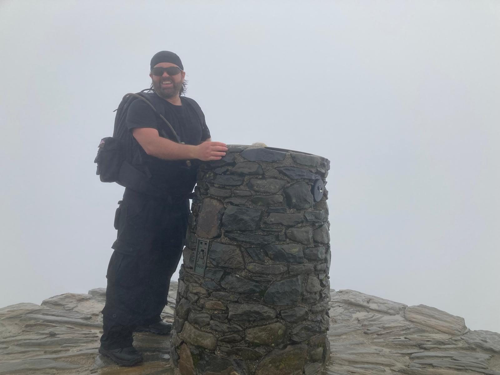Summit achievement in the mist