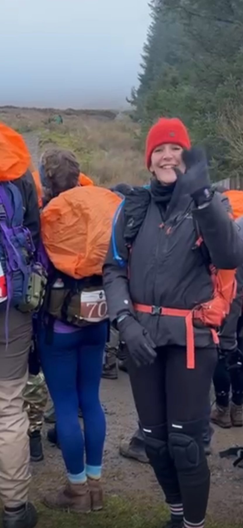 Rucker smiling on a mountain challenge